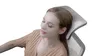 A woman is resting her head on the headrest of an office chair. Náhled obrázku produktu