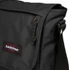 Close-up of a black Eastpak messenger bag, showing the zipper and logo. Produktbild-Vorschau