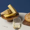 A still life arrangement of cheese, bread, and white wine. Voir les images du produit