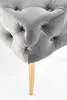 Close-up of a tufted gray bench leg with a gold accent. Produktbild-Vorschau