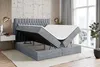 A bed with its storage compartment open, showing the mattress and the internal storage space. Produktbild-Vorschau