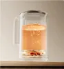 A close-up shot of a glass electric kettle filled with an orange liquid, showing it heating up. Náhľad obrázku produktu