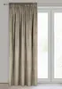 A single curtain hangs in front of a window. Podgląd zdjęcia produktu