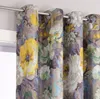 Close-up view of floral patterned curtains hanging from a curtain rod. Produktbild-Vorschau