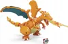 A LEGO-like model of Charizard, a Pokemon character, breathing fire. Voir les images du produit