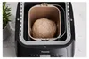 A close-up, overhead view of a bread maker with a ball of dough inside. Náhľad obrázku produktu