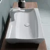 A white ceramic washbasin with a modern faucet is placed on a wooden countertop. Produktbild-Vorschau