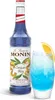 A bottle of Monin Blue Curacao syrup next to a glass of blue cocktail. Produktbild-Vorschau