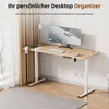 A modern standing desk in a home office setting, with a computer, keyboard, and cup on the surface. Anteprima dell’immagine prodotto
