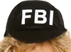 A close-up of a black cap with the letters "FBI" in white. Produktbild-Vorschau