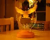 A Harry Potter-themed owl lamp is displayed on a table, with books in the background. Produktbild-Vorschau