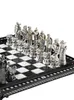 A close-up, angled view of a detailed chess set with intricately designed pieces, set up on a checkered board. Podgląd zdjęcia produktu