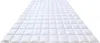 A white quilted duvet laid out flat on a white background. Produktbild-Vorschau