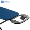 A close-up of an ironing board with a blue cover and a metal iron rest attachment. Produktbild-Vorschau