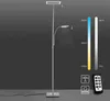 A modern LED floor lamp with a flexible reading light attachment, shown against a dark gray background. To the right, there are visual representations of color temperature and brightness adjustments, along with a remote control and icons indicating memory  Produktbild-Vorschau
