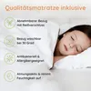A child sleeping on a mattress, with feature callouts. Produktbild-Vorschau