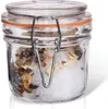 A clear glass jar with a clamp lid, filled with white salt and dried herbs or spices. Náhled obrázku produktu