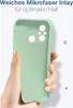 A hand is holding a light green phone case, showing its interior. Produktbild-Vorschau