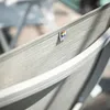 A close-up of a KETTLER outdoor chair with a logo tag. Produktbild-Vorschau