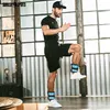 A man is exercising indoors, wearing ankle weights. Náhled obrázku produktu