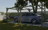 A car is parked under a wooden carport in a garden setting. Produktbild-Vorschau