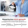 A person is pouring hot water from a kettle into a mug in a kitchen setting. Produktbild-Vorschau