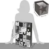 A person's silhouette is shown next to a black and white advent calendar with 24 drawers, some of which are open. Dimensions are provided for the calendar and a single drawer. Náhled obrázku produktu