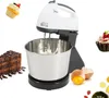 A kitchen mixer is shown in the center, surrounded by various baked goods and ingredients like cake, cupcakes, and eggs. Produktbild-Vorschau