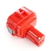 A red power tool battery is shown against a white background. Voir les images du produit