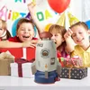 Children celebrating a birthday party with gifts and a rocket toy. Produktbild-Vorschau