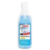 A bottle of SONAX Antifrost+KlarSicht Konzentrat with a label showing a winter scene. Produktbild-Vorschau