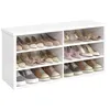 A white shoe rack filled with various shoes. Produktbild-Vorschau