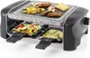 A mini raclette grill with food cooking on the stone plate and in the trays below. Produktbild-Vorschau