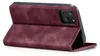 A burgundy flip cover case for an iPhone 13 is shown standing upright, propped open. Produktbild-Vorschau