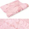 A pink yoga mat with a leaf pattern, shown rolled up and unrolled. Podgląd zdjęcia produktu