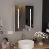 A modern bathroom vanity with a round sink, faucet, and a lighted medicine cabinet above. Accessories like bottles and a vase of flowers are on the counter. Produktbild-Vorschau