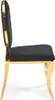 A side view of a black and gold chair. Podgląd zdjęcia produktu