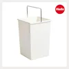 A white trash can with a metal handle against a white background. Podgląd zdjęcia produktu