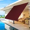 A maroon awning is extended over a patio area next to a swimming pool, with furniture visible in the background. Anteprima dell’immagine prodotto