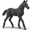 A black toy horse figurine on a white background. Produktbild-Vorschau