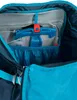 Close-up view of the inside of a backpack, showing a hydration bladder and tube. Produktbild-Vorschau