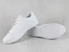 A pair of white Puma sneakers on a light gray textured surface. Produktbild-Vorschau
