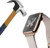 A hammer is shown about to strike a smartwatch. Produktbild-Vorschau