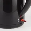 Close-up of a black electric kettle's power switch with an indicator light. Produktbild-Vorschau