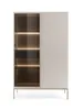 A modern display cabinet with glass doors and a fluted panel, shown against a white background. Produktbild-Vorschau