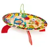 An oval-shaped wooden activity table for children, featuring various interactive elements and colorful jungle-themed illustrations. Podgląd zdjęcia produktu