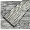 A close-up view of a decorative foam panel with a concrete look, laid diagonally over a background of similar panels. Produktbild-Vorschau