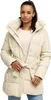 A woman wearing a beige puffer coat.