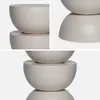 Collage of close-up shots of a round, stacked table. Produktbild-Vorschau