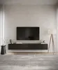 A modern living room setup with a wall-mounted TV board. Produktbild-Vorschau